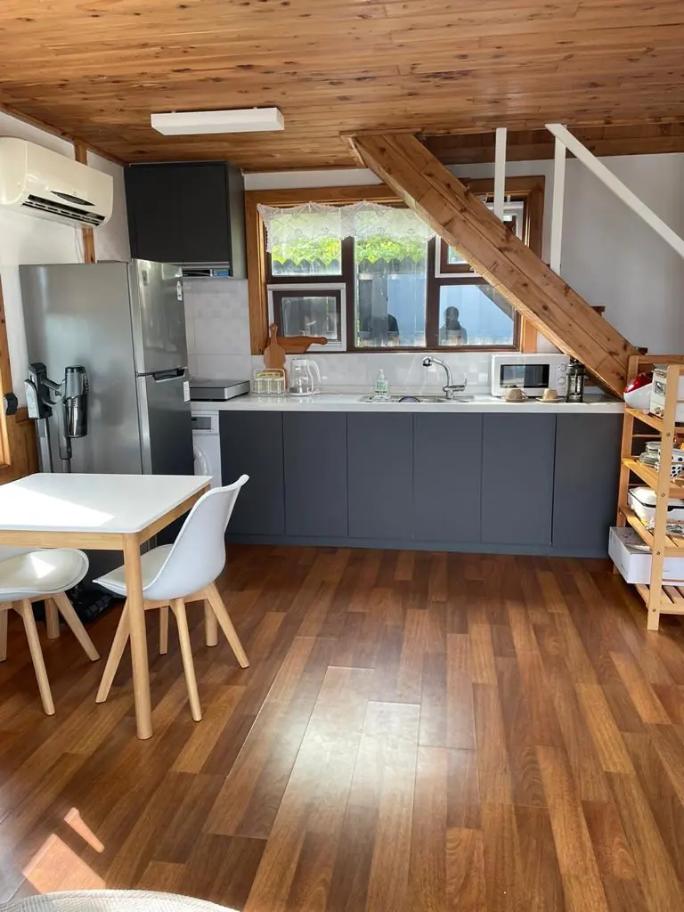 Open kitchen and the stair to the bedrooms