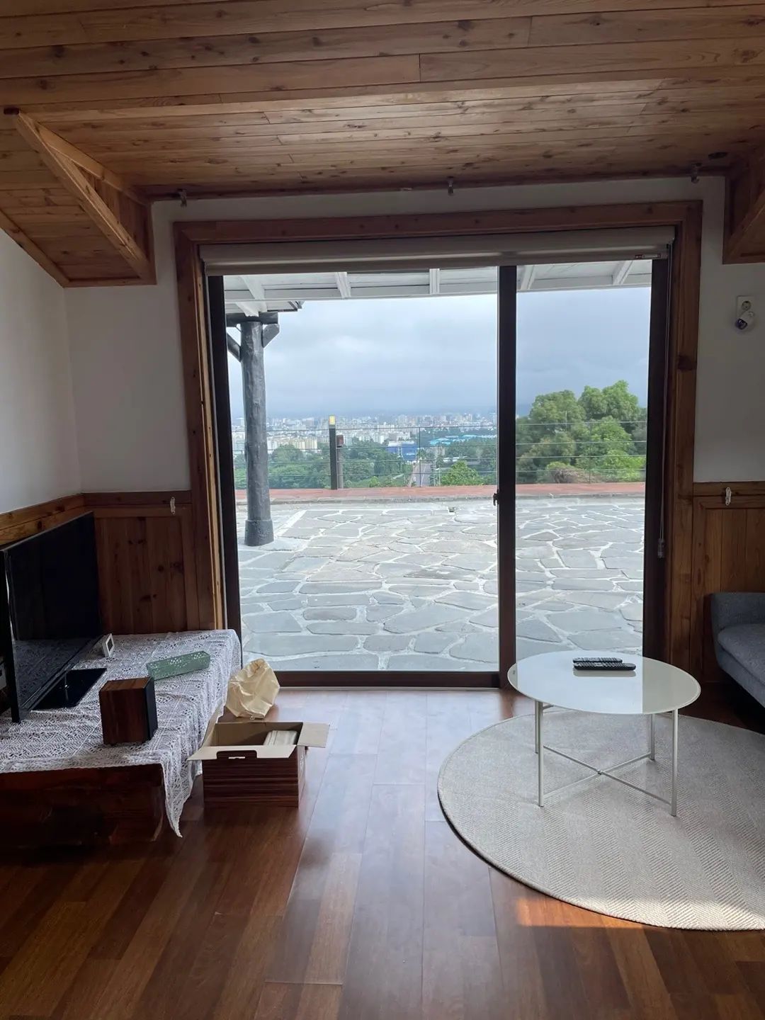 The living room opens onto the stone terrace