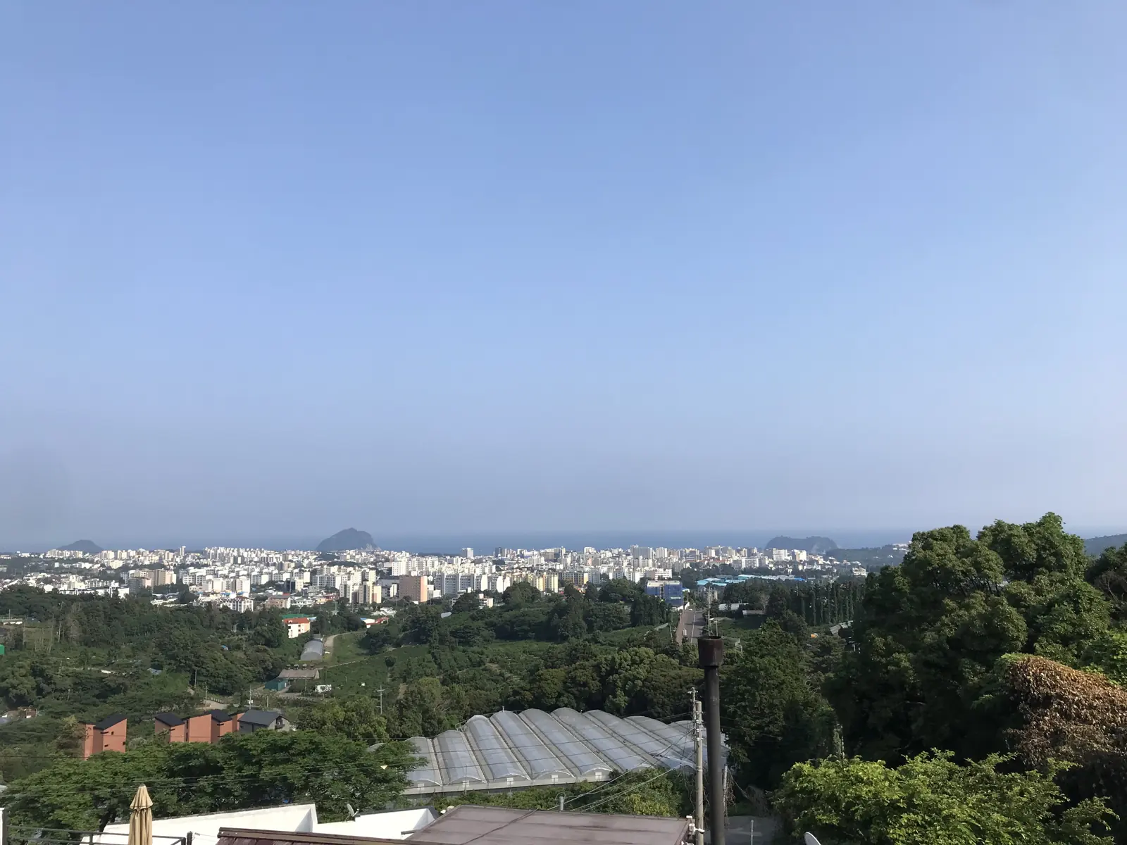 View over Seogwipo to the sea and offshore islands